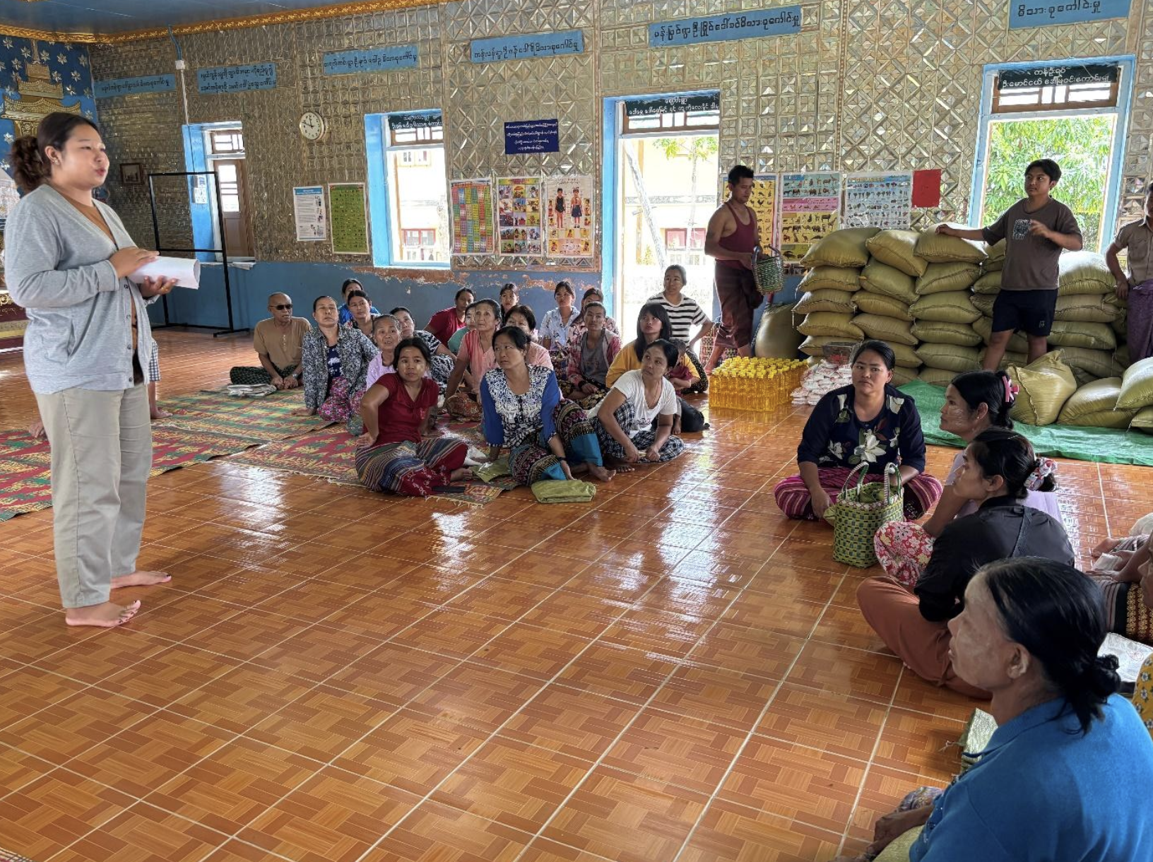 Meeting with local village representatives to cross-verify resource delivery schedules.
